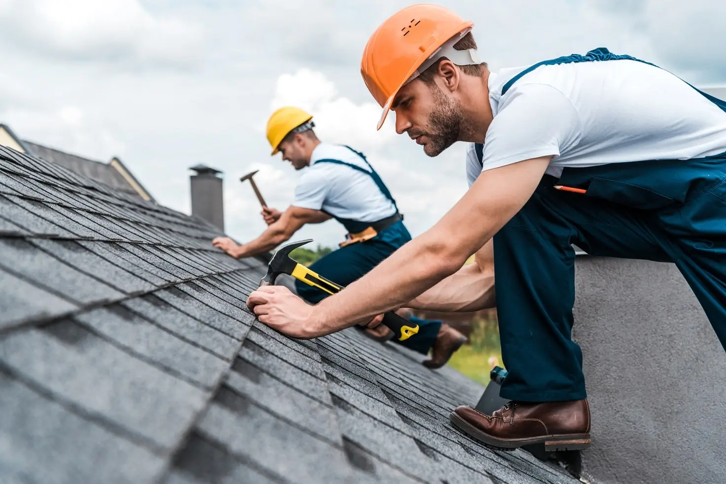 Roofers working on a roof